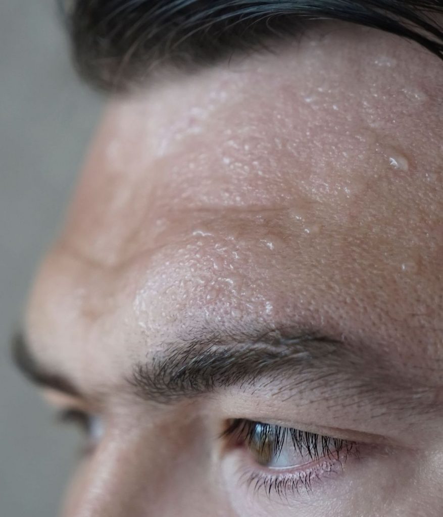 Sweat on a man's forehead